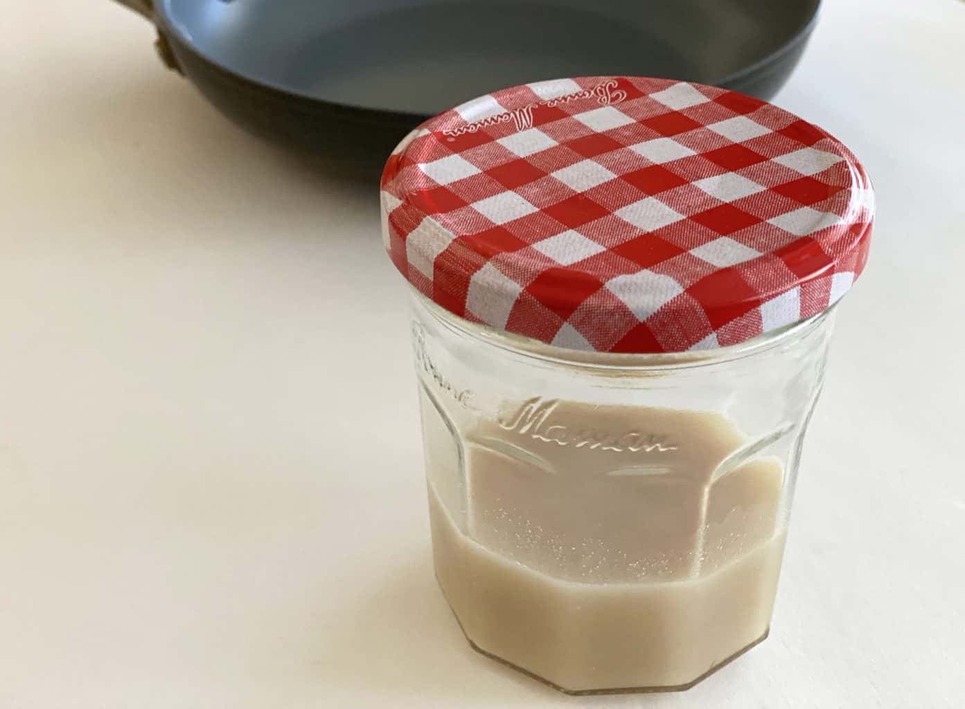 A jar of strained bacon fat.
