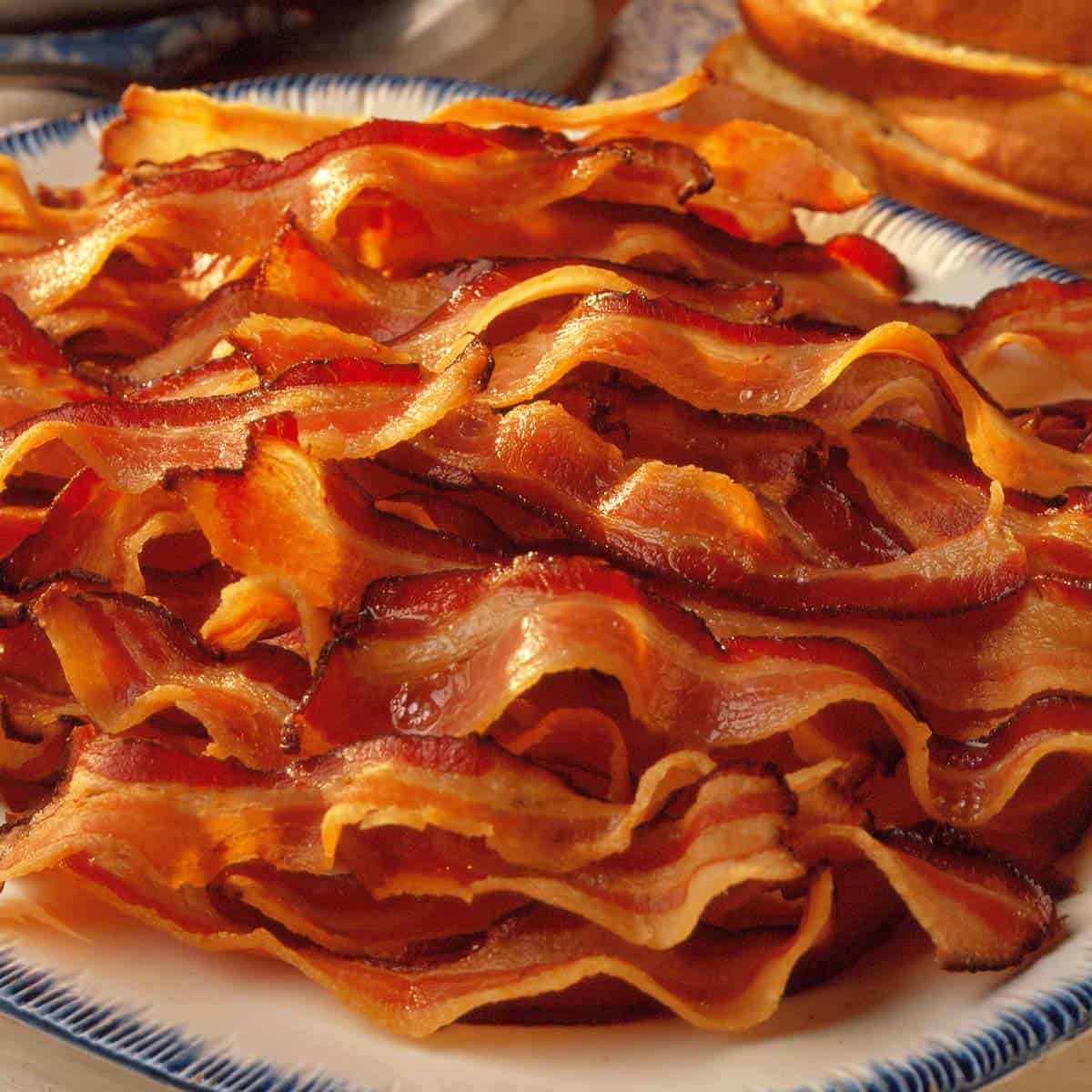A plate of cooked bacon.