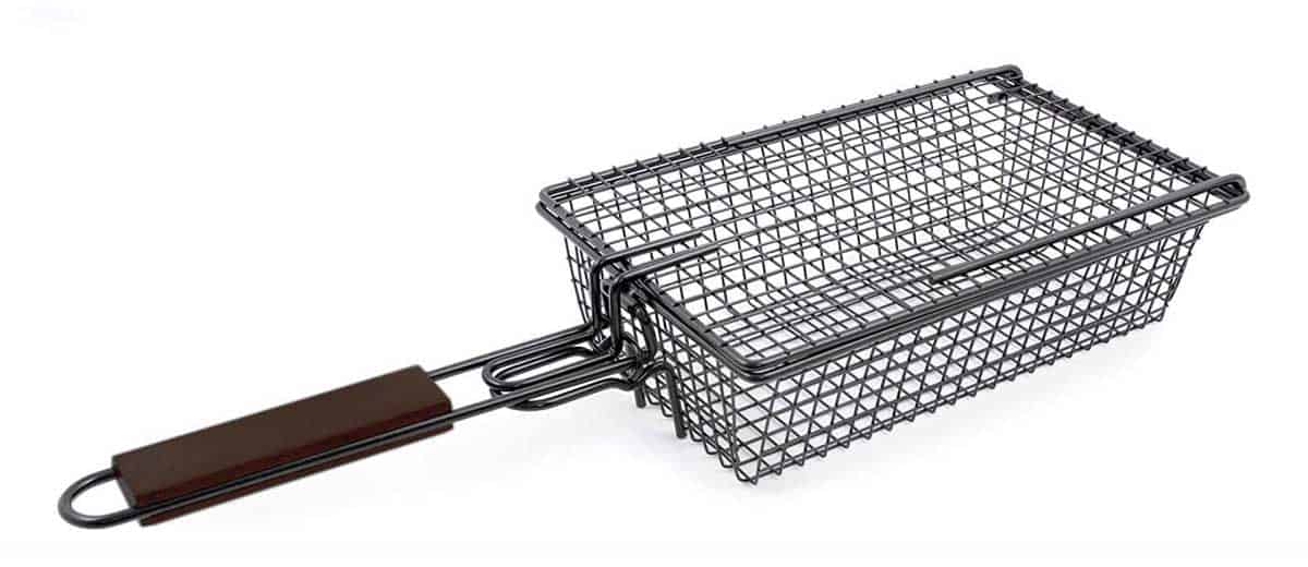 A grilling basket with a handle for cooking bacon on a grill