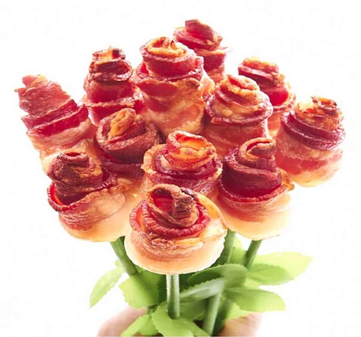 A bouquet with 12 roses, each made from a strip of bacon wound in a rose shape. 