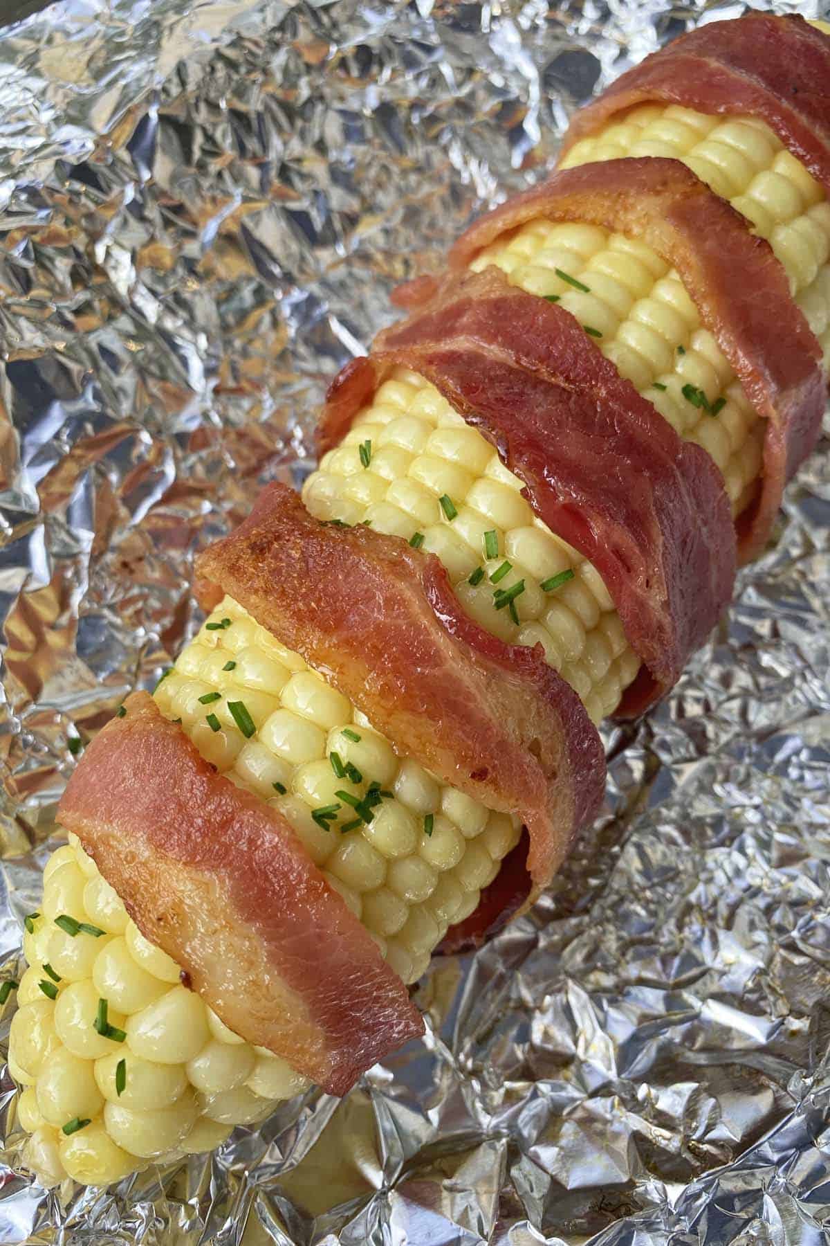 Bacon wrapped corn on the cob, finished and hot off the grill