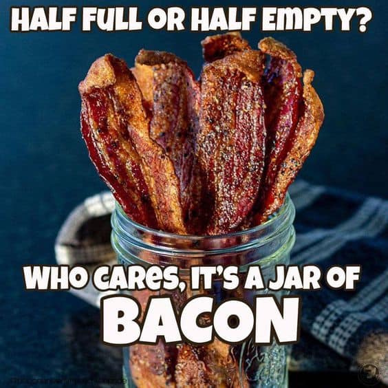 A jar of candied bacon and text:  Half full or half empty? How cares, it's a jar of BACON.