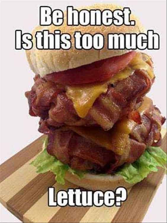 A tall cheeseburger packed with eight pieces of bacon and one lettuce leaf and text: Be honest. Is this too much lettuce? 