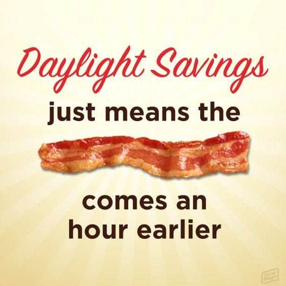 A strip of bacon and text: Daylight Savings just means the bacon comes an hour earlier