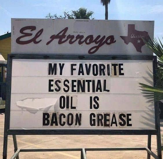 A sign which reads: My favorite essential oil is bacon grease