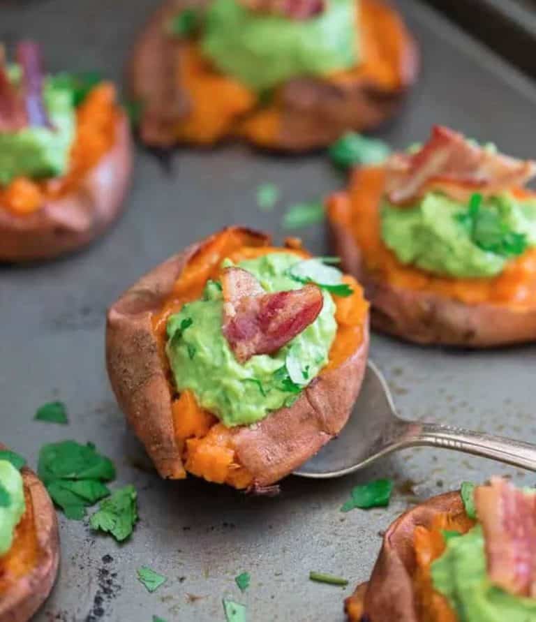 6 sweet potato bacon guacamole bites on a baking sheet