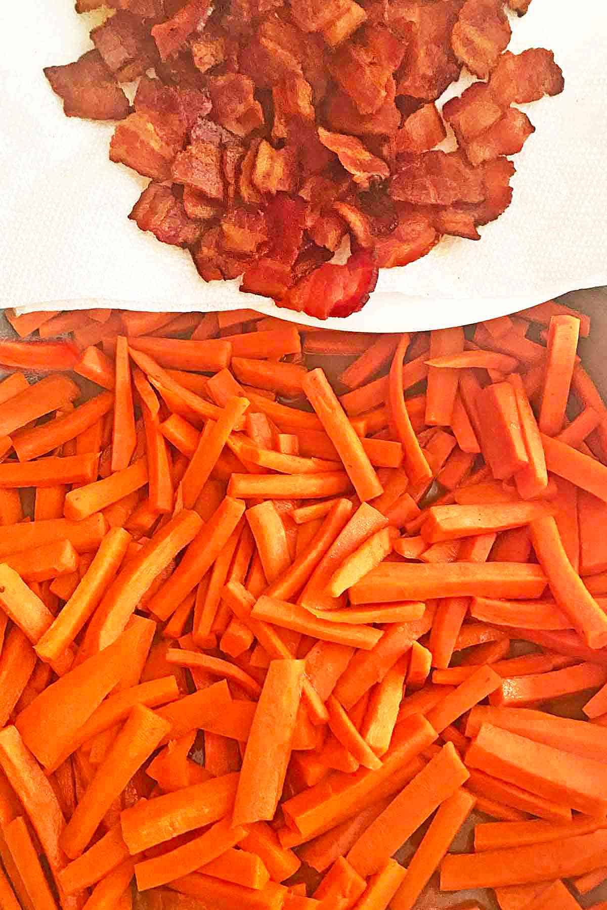 Adding cooked bacon bits to the maple glazed carrots.