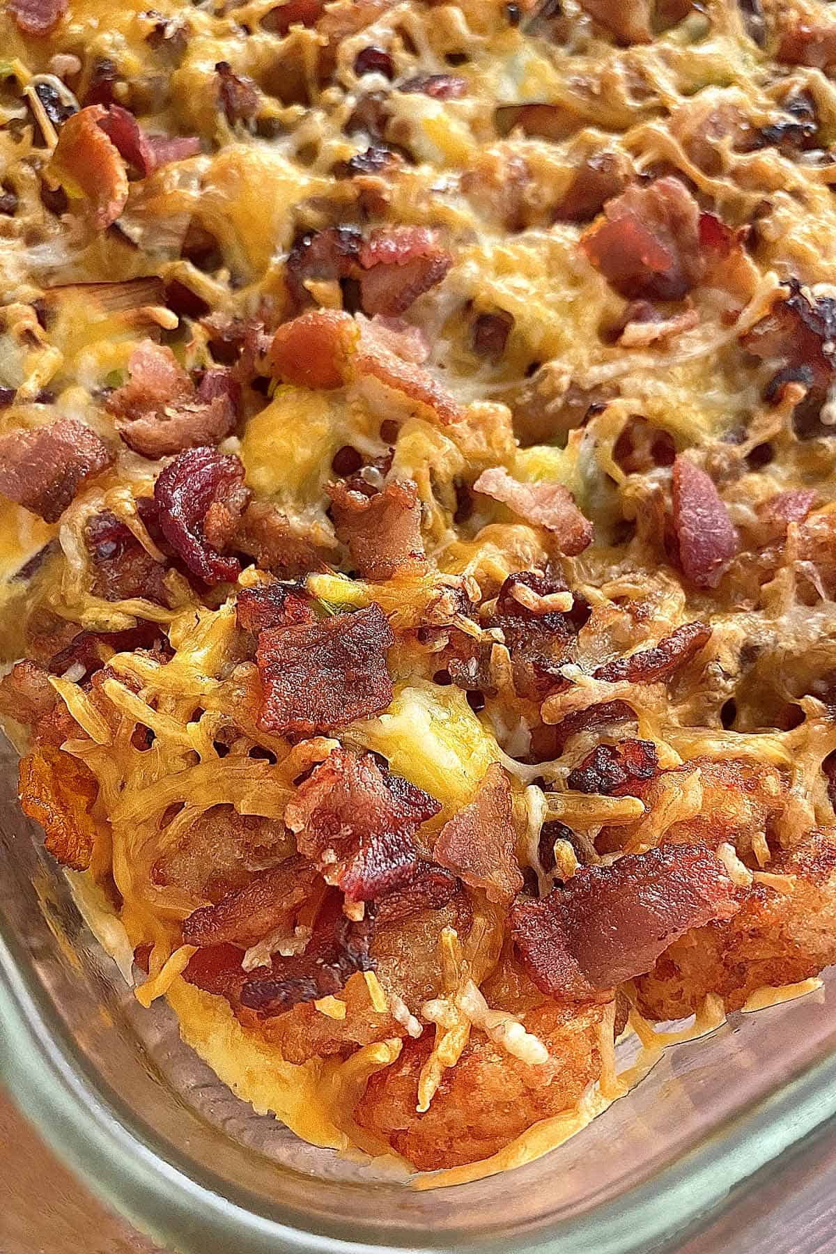 Finished dish of overnight tater tot breakfast casserole with bacon and sausage