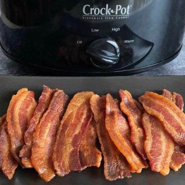 16 half slices of cooked bacon on a black platter in front of a black crock pot.