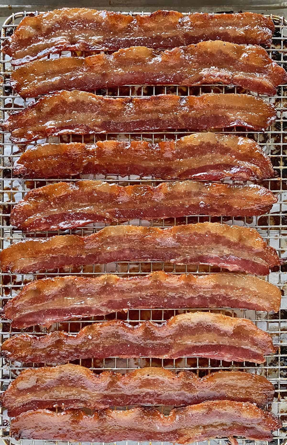 A pan of golden brown, glazed million dollar bacon just out of the oven.