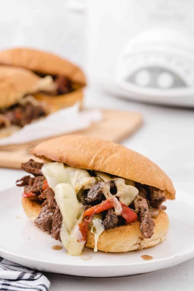 Crockpot Philly Cheesesteak sandwiches on toasted buns.