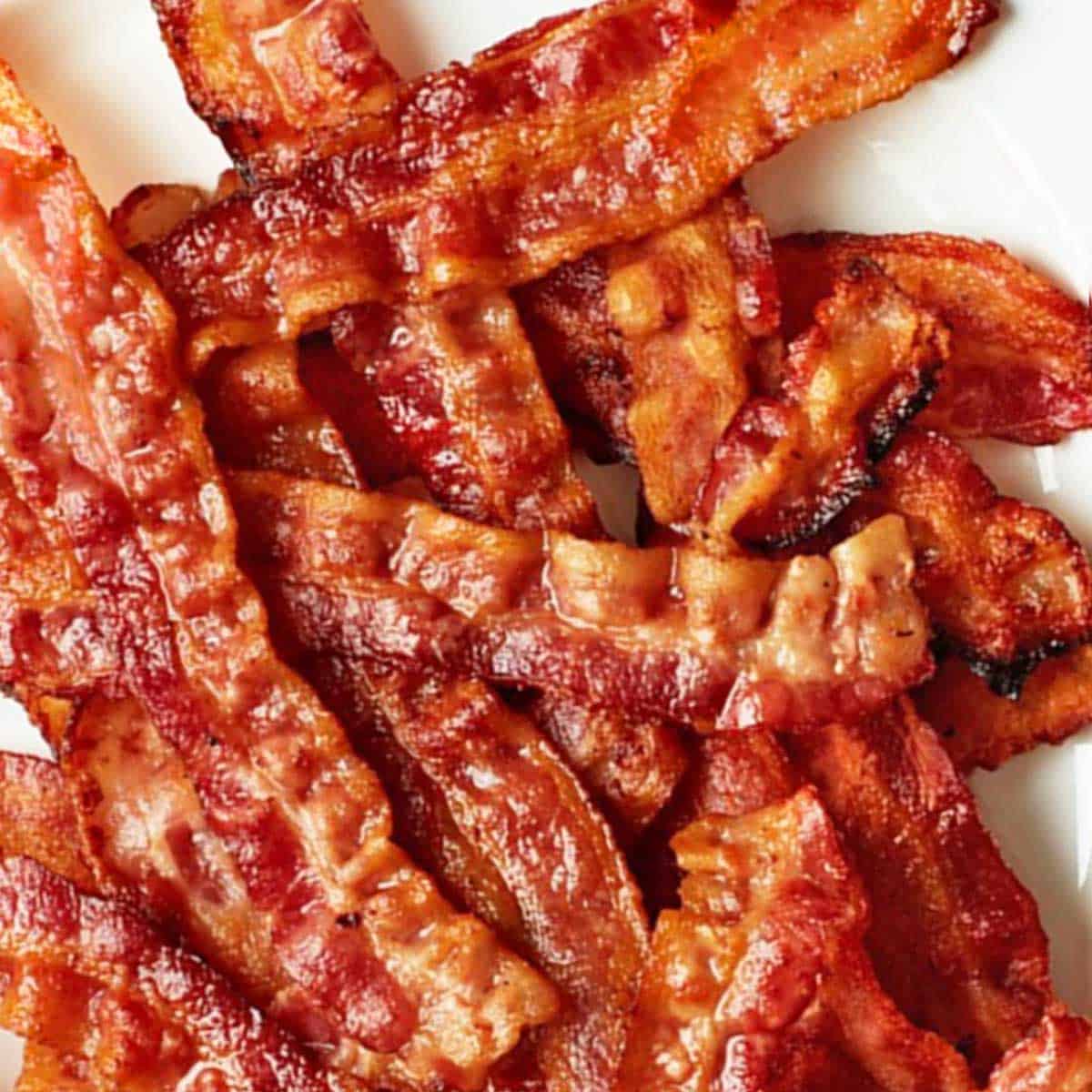 A pound of crispy, golden brown bacon cooked in the oven.