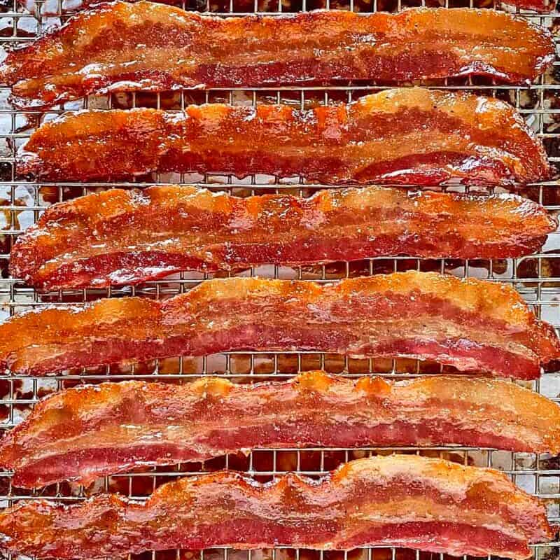Six strips of cooked golden brown Million Dollar Bacon.