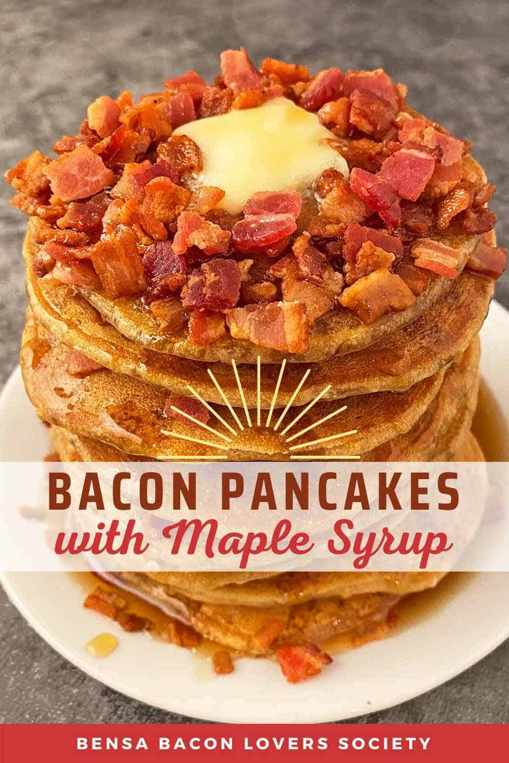 A tall stack of bacon pancakes with maple syrup.