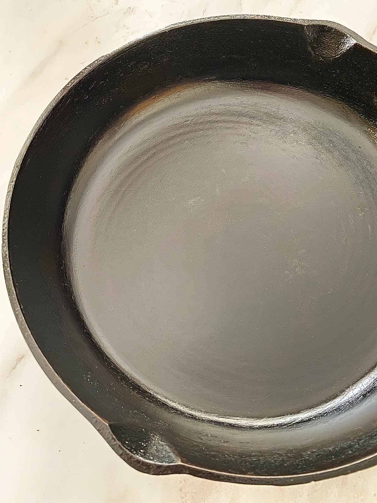 A perfectly seasoned cast iron skillet.