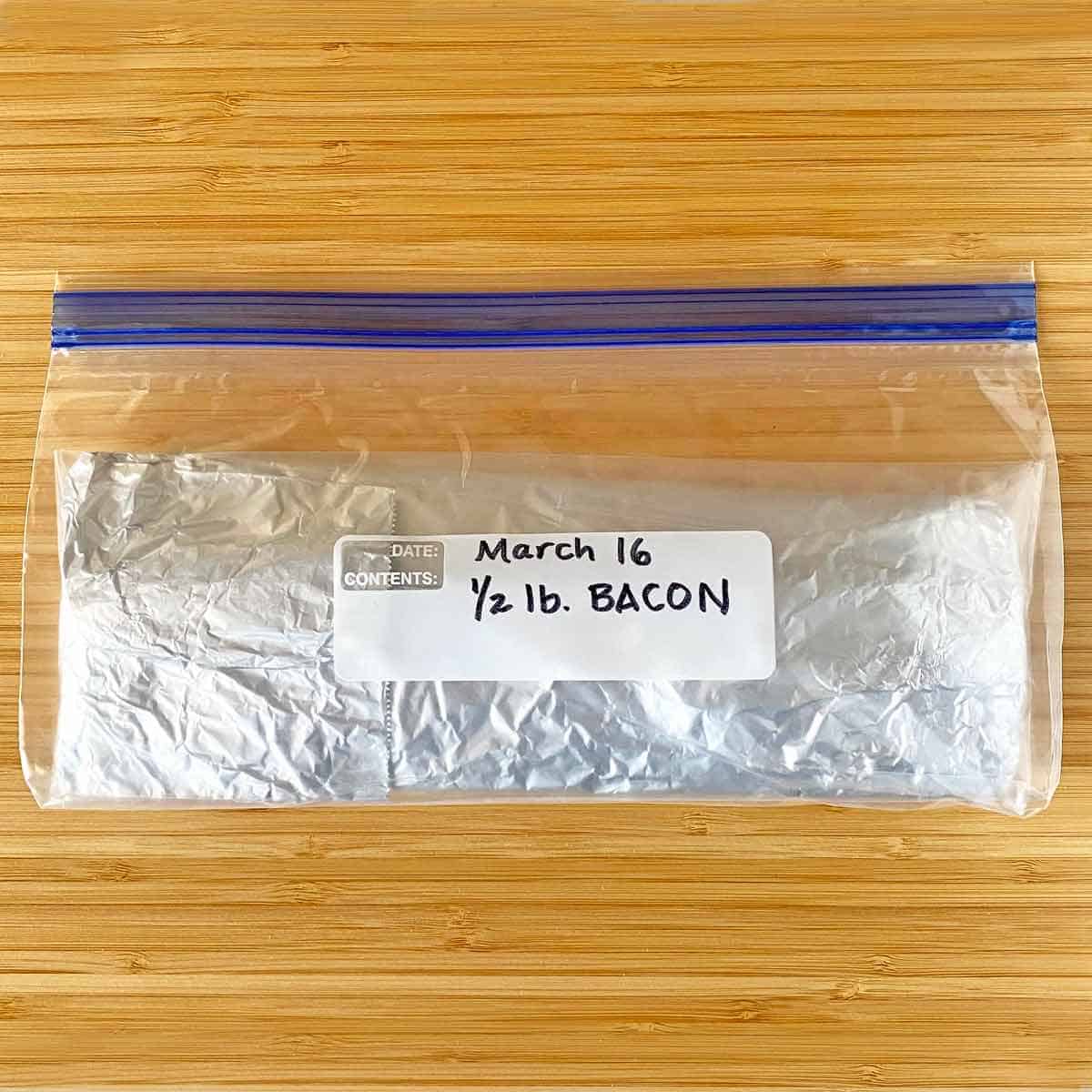 An open package of bacon triple wrapped and ready for the fridge or freezer.