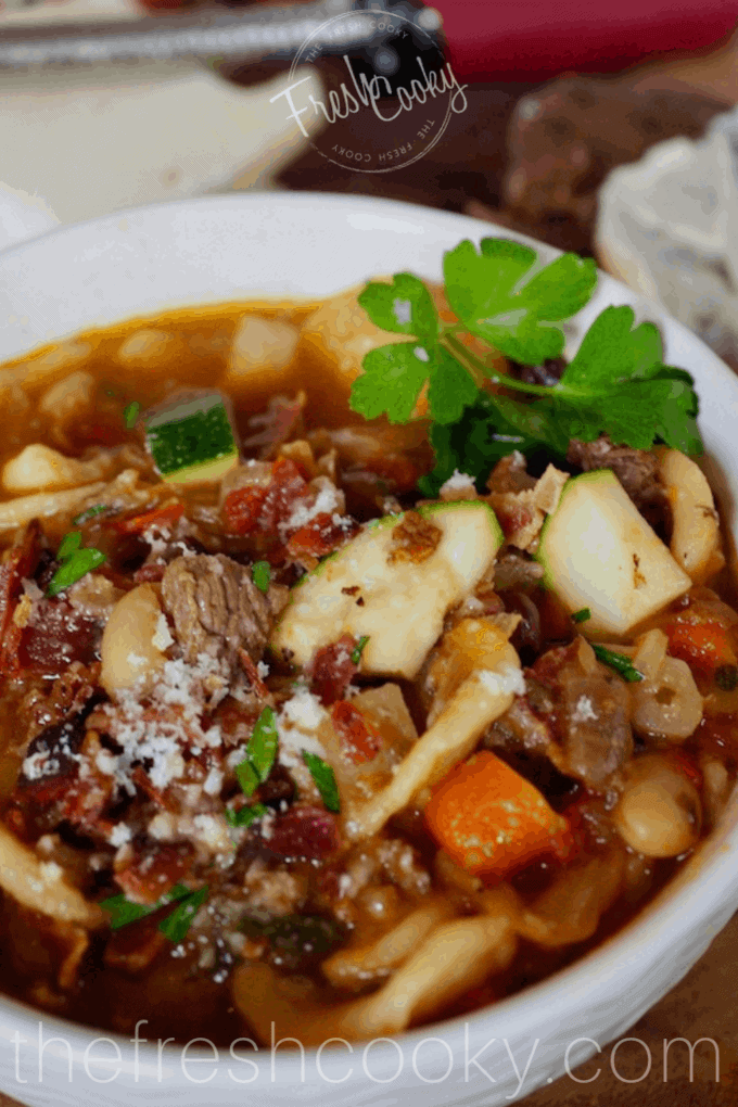 A bowl of bacon beef minestrone soup.