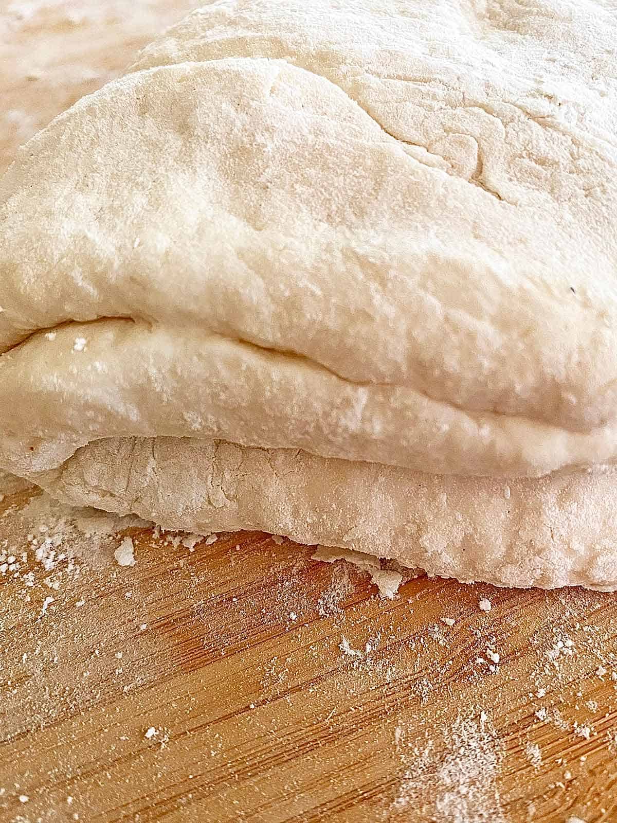 Biscuit dough that has been folded 8 times.