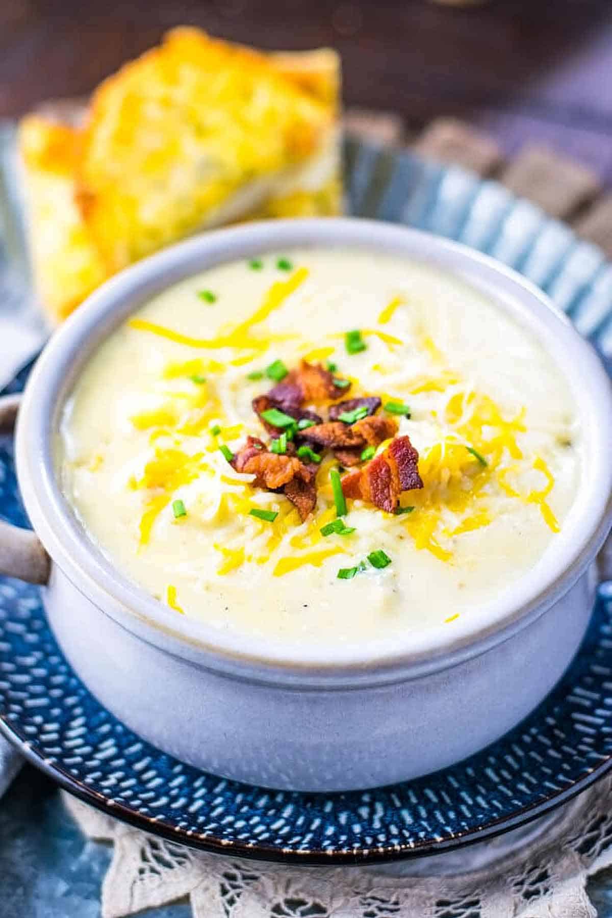 A bowl of creamy potato soup with bacon.