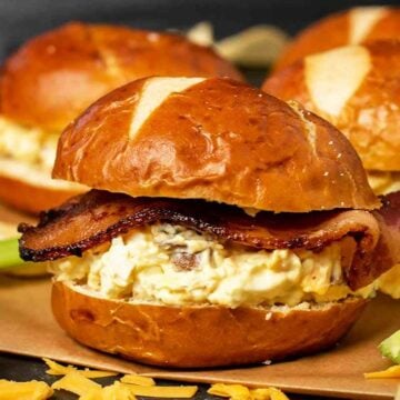 Close up of 3 bacon egg salad sandwiches.