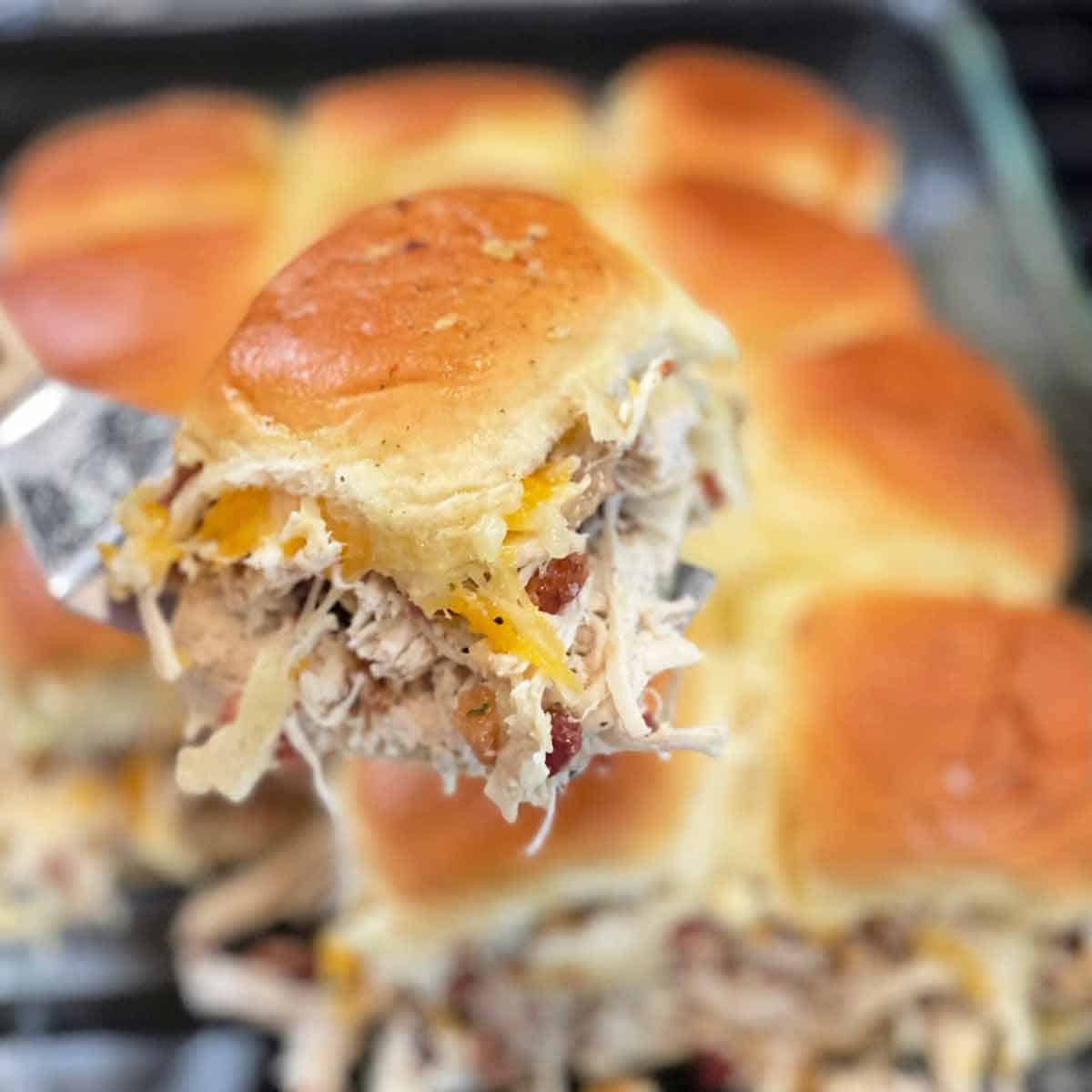 Close up of chicken bacon ranch sliders being served.