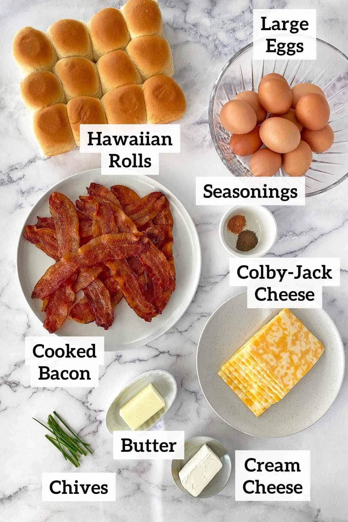 Hawaiian rolls, bacon, eggs, cheese and ingredients to make breakfast sliders.